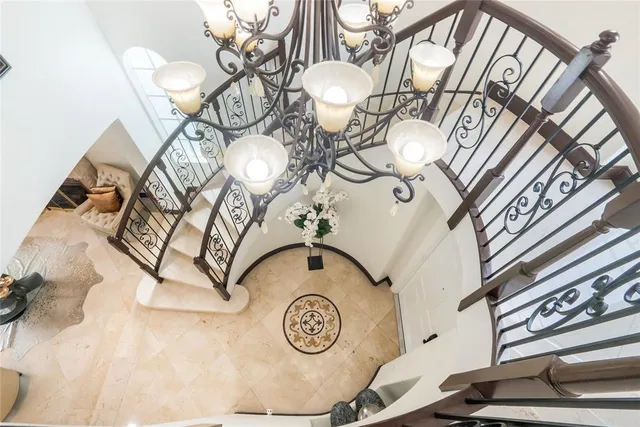 a view of a livingroom with wooden floor and windows