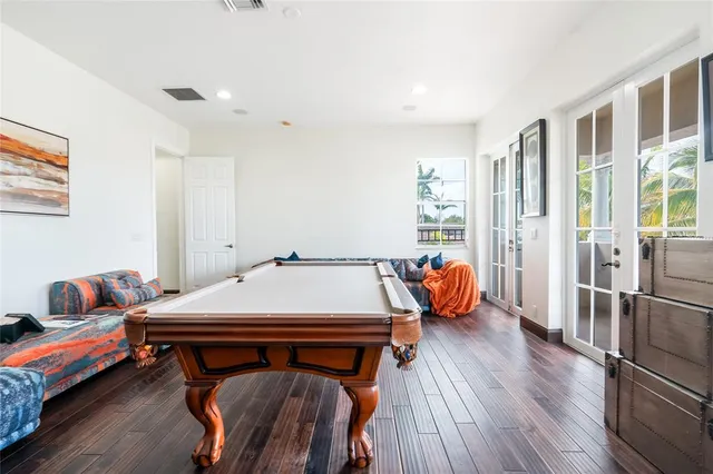 a spacious bathroom with a granite countertop sink a mirror and a toilet