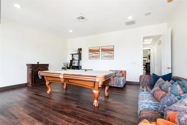 a bedroom with a bed and a chair