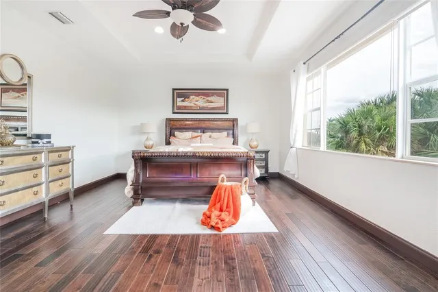 a view of a hallway with entryway wooden floor and front door