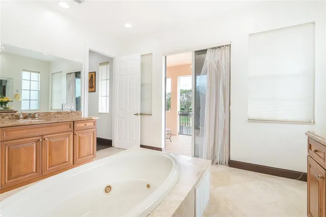 a view of swimming pool with a lounge chairs