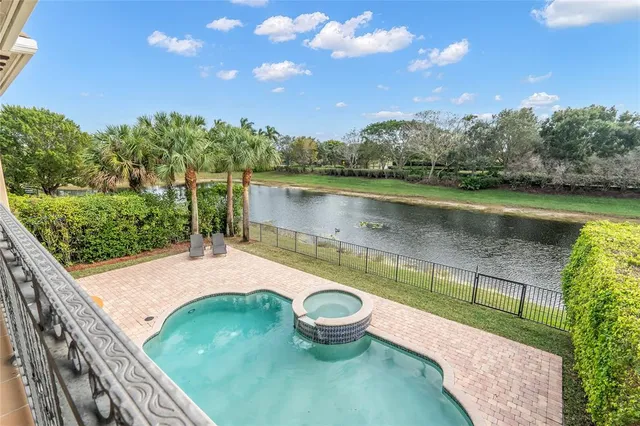 an aerial view of a house with a yard and a garden
