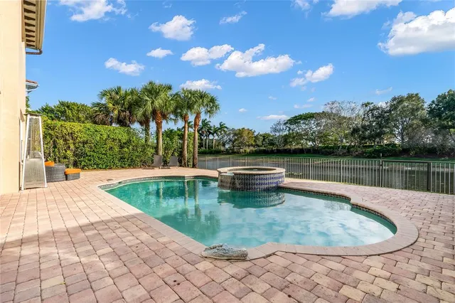 an aerial view of a house with a swimming pool
