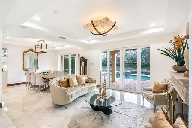 a view of a dining room with furniture wooden floor and chandelier