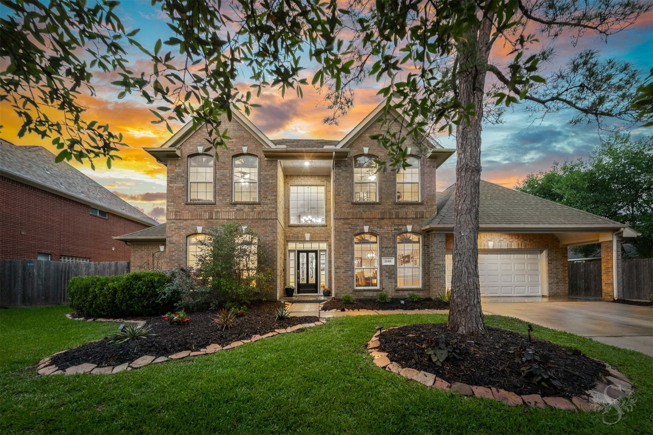 20410 Lake Spring Court Cypress, TX 77433 - Photo 1 of 50 a front view of a house with a yard and a tree