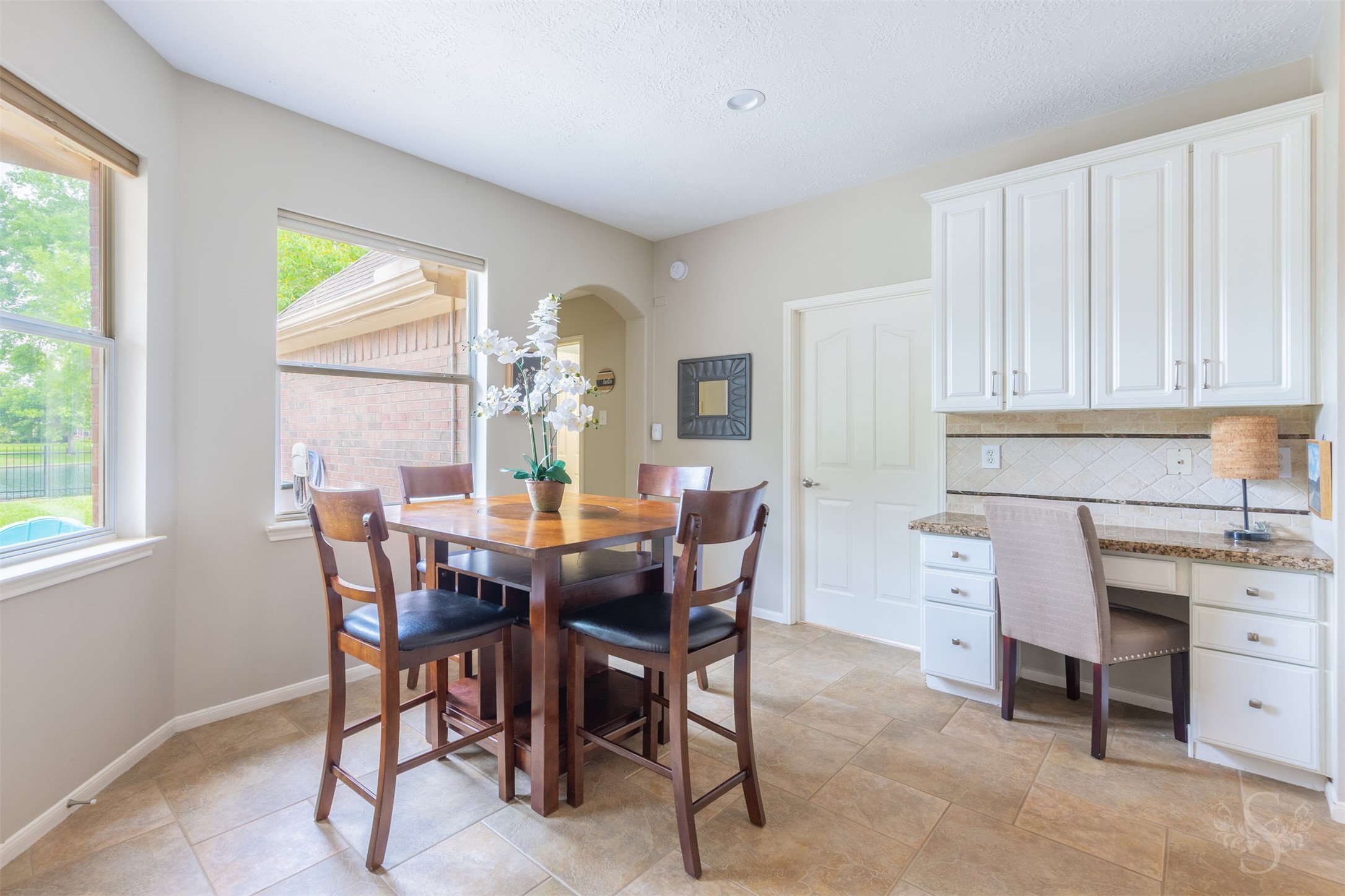 20410 Lake Spring Court Cypress, TX 77433 - Photo 19 of 50 a view of a dining room with furniture and window