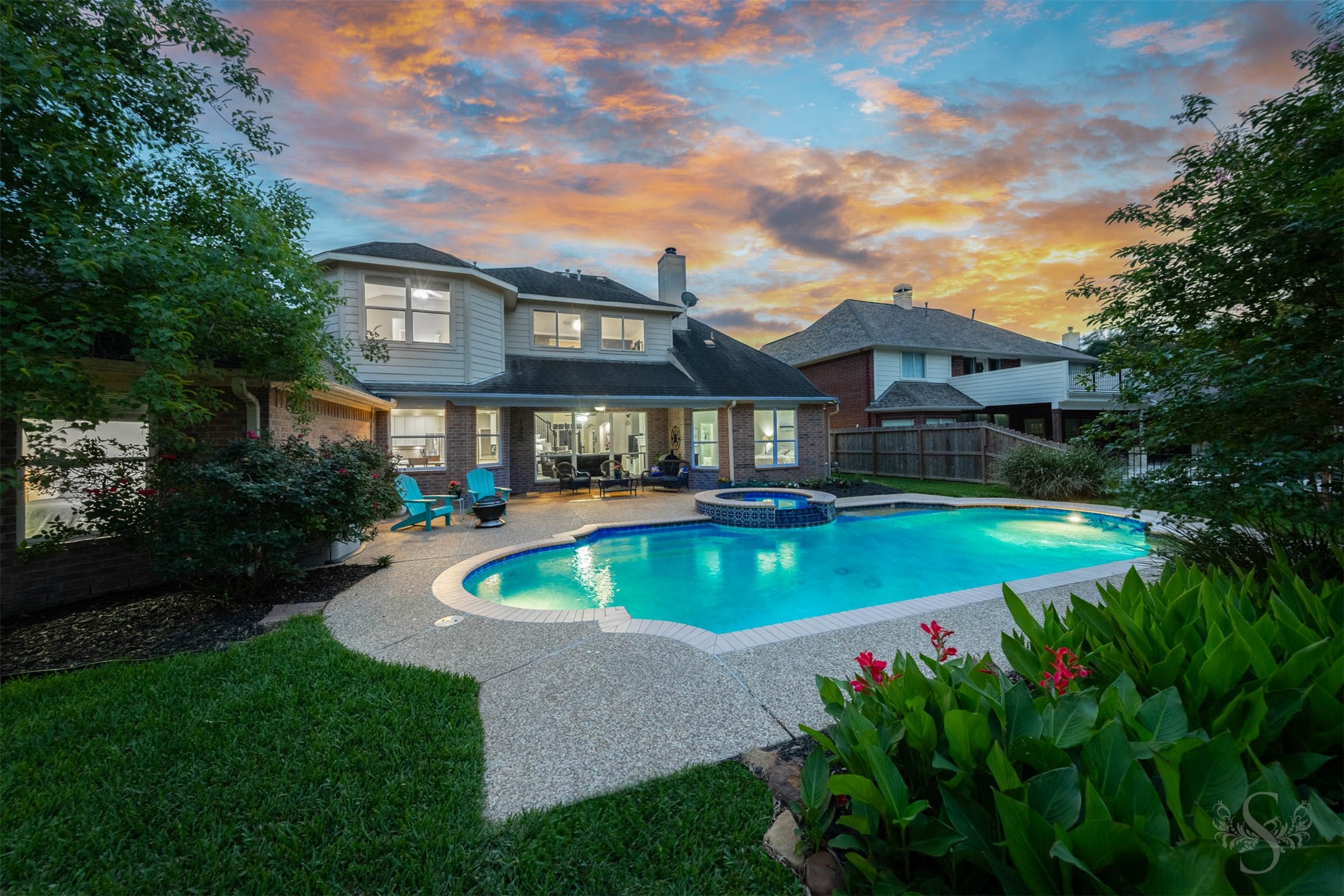 20410 Lake Spring Court Cypress, TX 77433 - Photo 2 of 50 a view of a house with swimming pool and garden