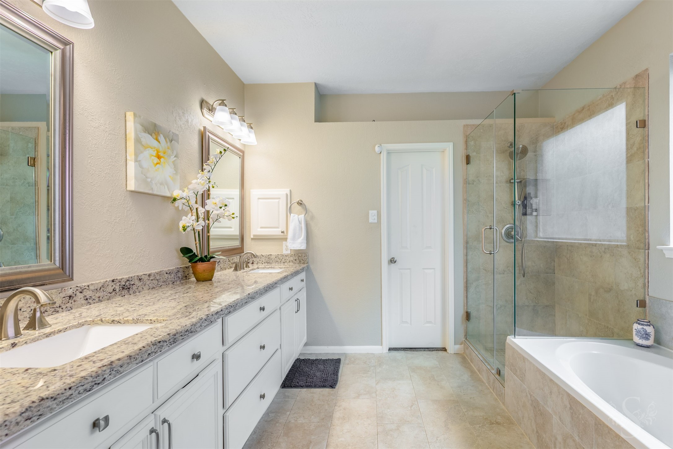 20410 Lake Spring Court Cypress, TX 77433 - Photo 24 of 50 a spacious bathroom with a granite countertop sink mirror and a bathtub