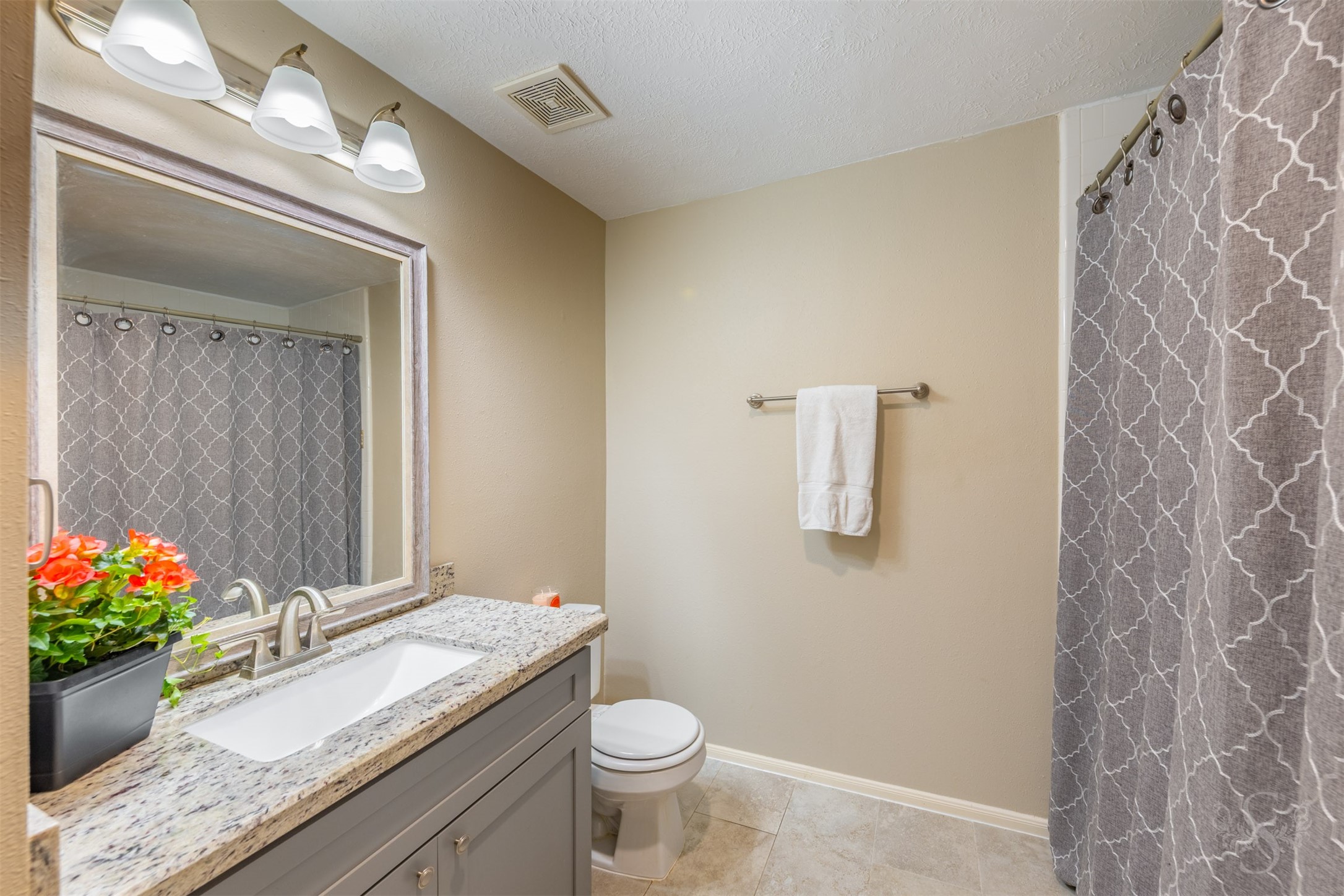 20410 Lake Spring Court Cypress, TX 77433 - Photo 33 of 50 a bathroom with a granite countertop sink and a mirror