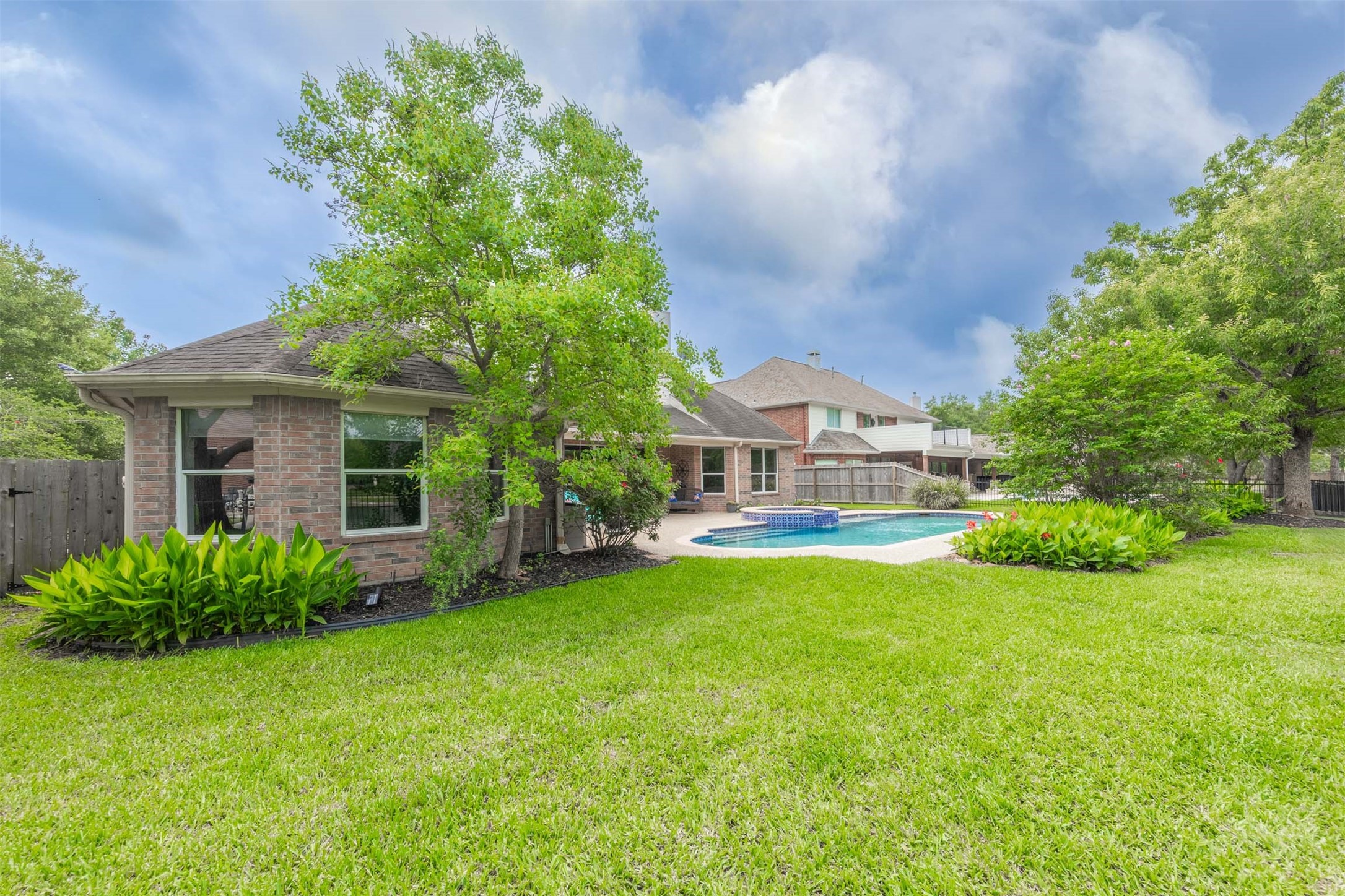 20410 Lake Spring Court Cypress, TX 77433 - Photo 44 of 50 a view of a house with a yard and sitting area