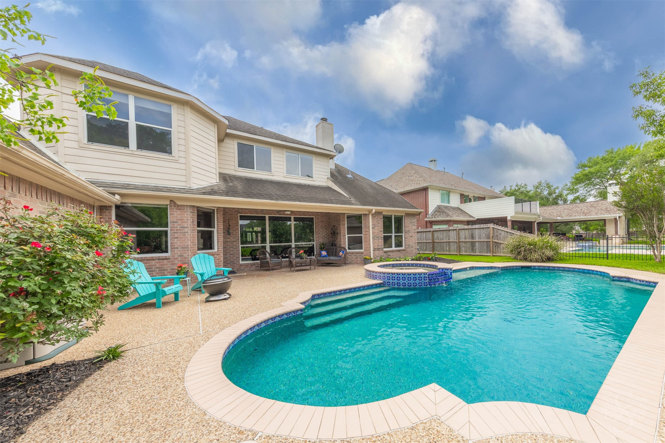 20410 Lake Spring Court Cypress, TX 77433 - Photo 46 of 50 a view of a house with swimming pool and porch