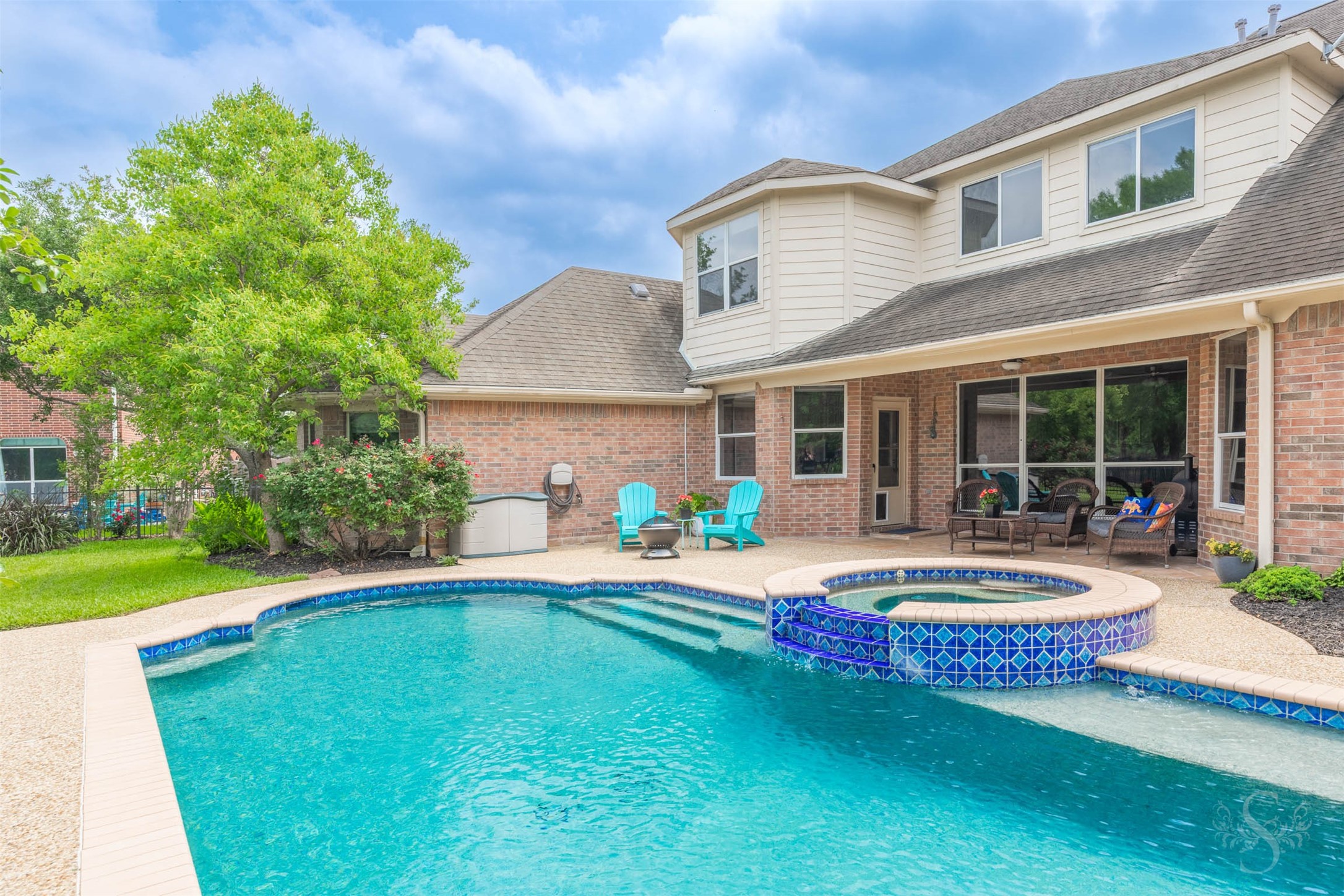 20410 Lake Spring Court Cypress, TX 77433 - Photo 47 of 50 a front view of a house with swimming pool having outdoor seating