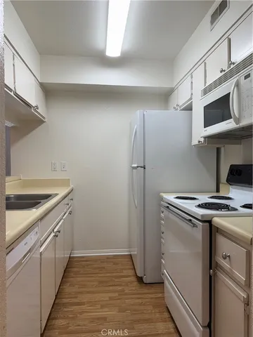 a kitchen with a stove and a microwave