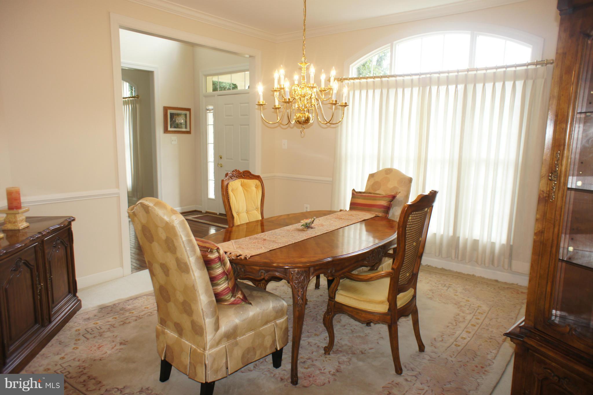 10871 Meanderview Court Manassas, VA 20111 - Photo 3 of 30 Dining Room w/ crown & chair molding