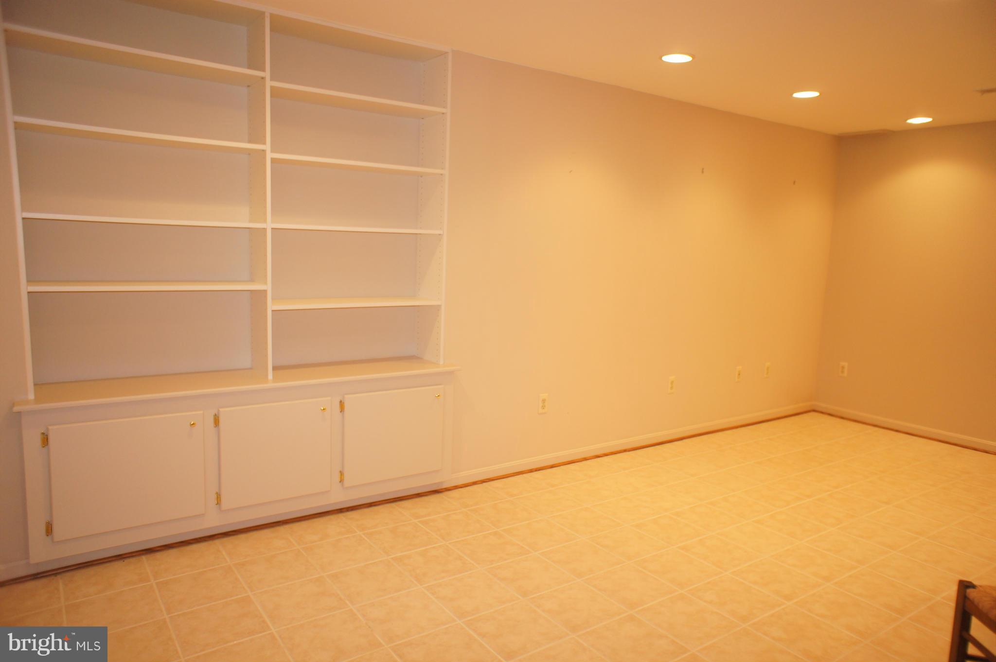 10871 Meanderview Court Manassas, VA 20111 - Photo 21 of 30 Basement Rec Area w/ built-ins