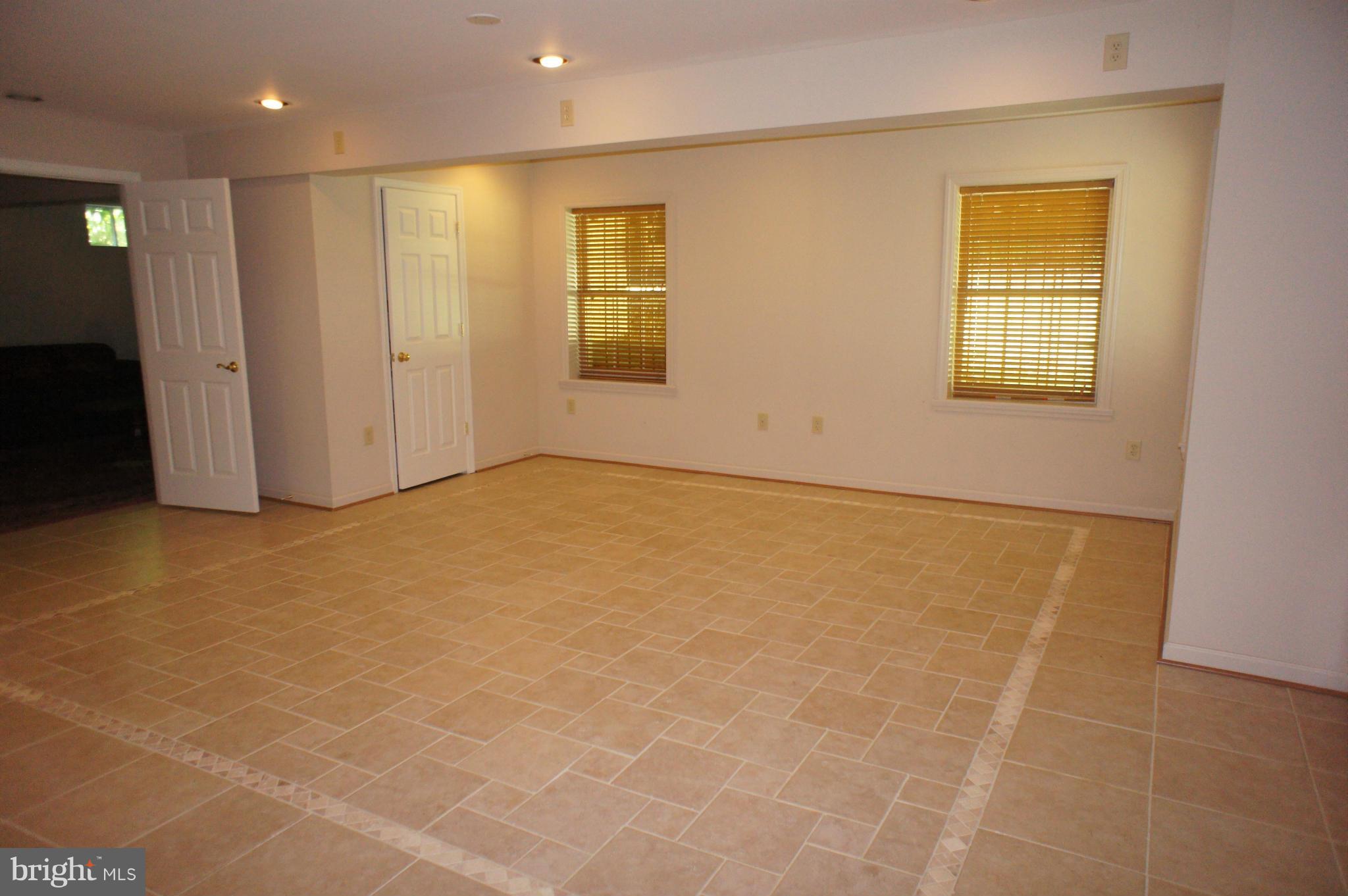 10871 Meanderview Court Manassas, VA 20111 - Photo 22 of 30 Basement Rec-Room w/ tile floor