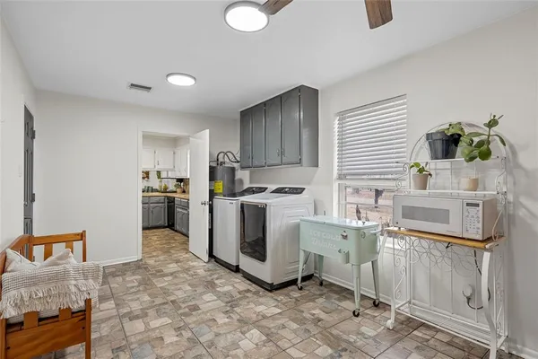 a kitchen with a stove a sink and a refrigerator