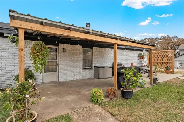 front view of a house with potted plants