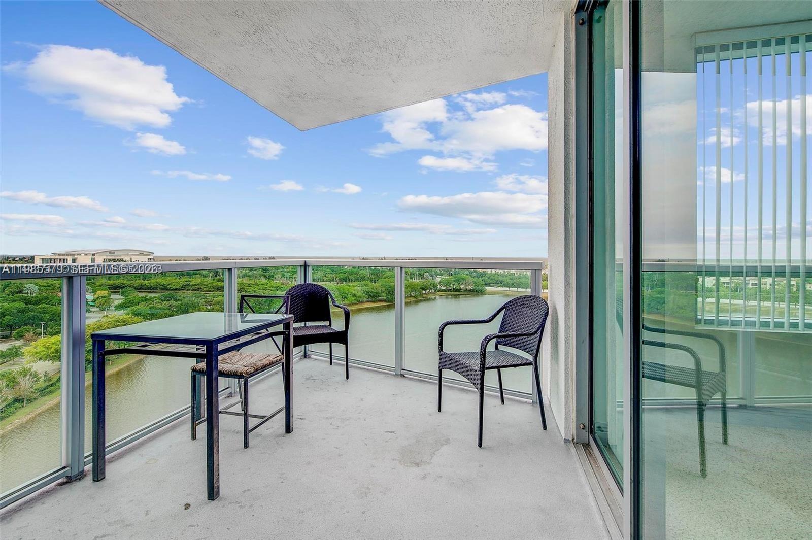 2681 North Flamingo Road, Unit 1201S Sunrise, FL 33323 - Photo 18 of 28 a view of a terrace with furniture and a garden