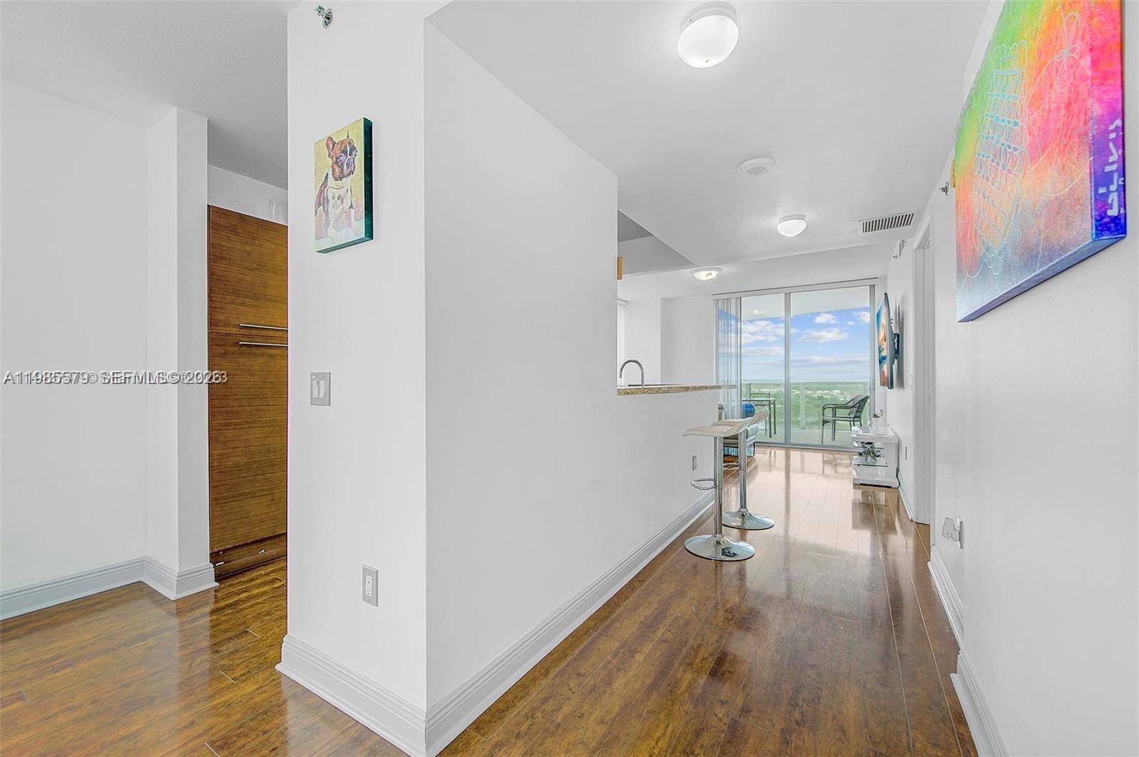 2681 North Flamingo Road, Unit 1201S Sunrise, FL 33323 - Photo 6 of 28 a view of empty room with wooden floor