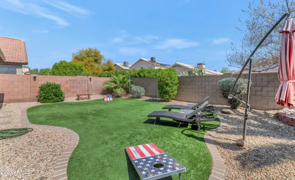 a view of a backyard with sitting area