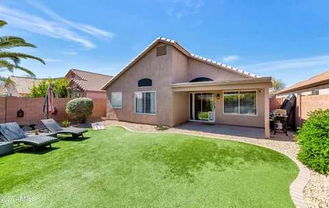 a front view of a house with a yard and porch