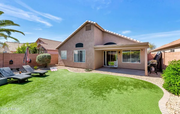a front view of a house with a yard and porch