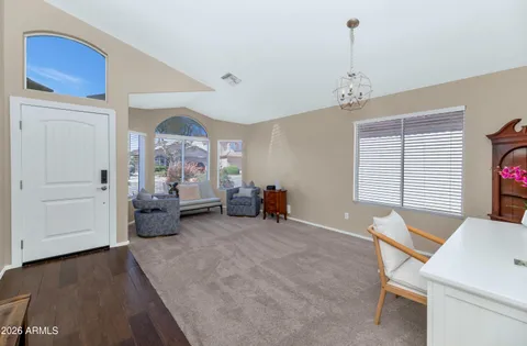 a view of a livingroom with furniture and windows