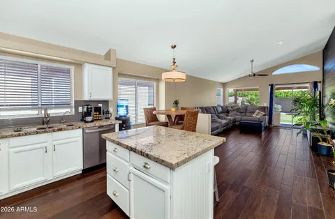 a kitchen with sink and cabinets