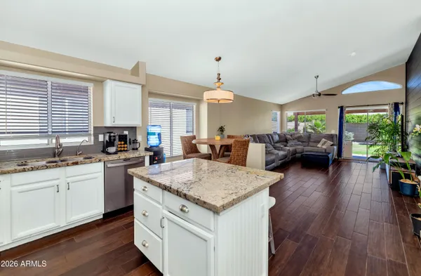 a kitchen with sink and cabinets