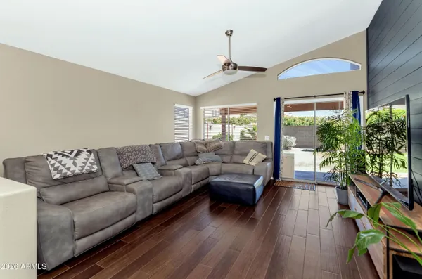 a living room with furniture and a large window