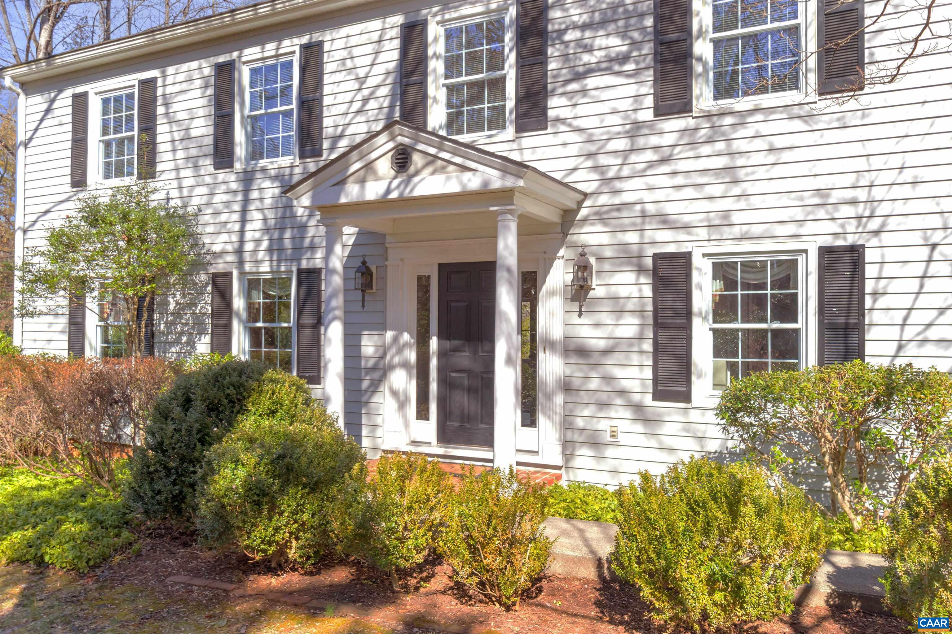 2091 Whippoorwill Road Charlottesville, VA 22901 - Photo 5 of 41 front view of a brick house with a large window