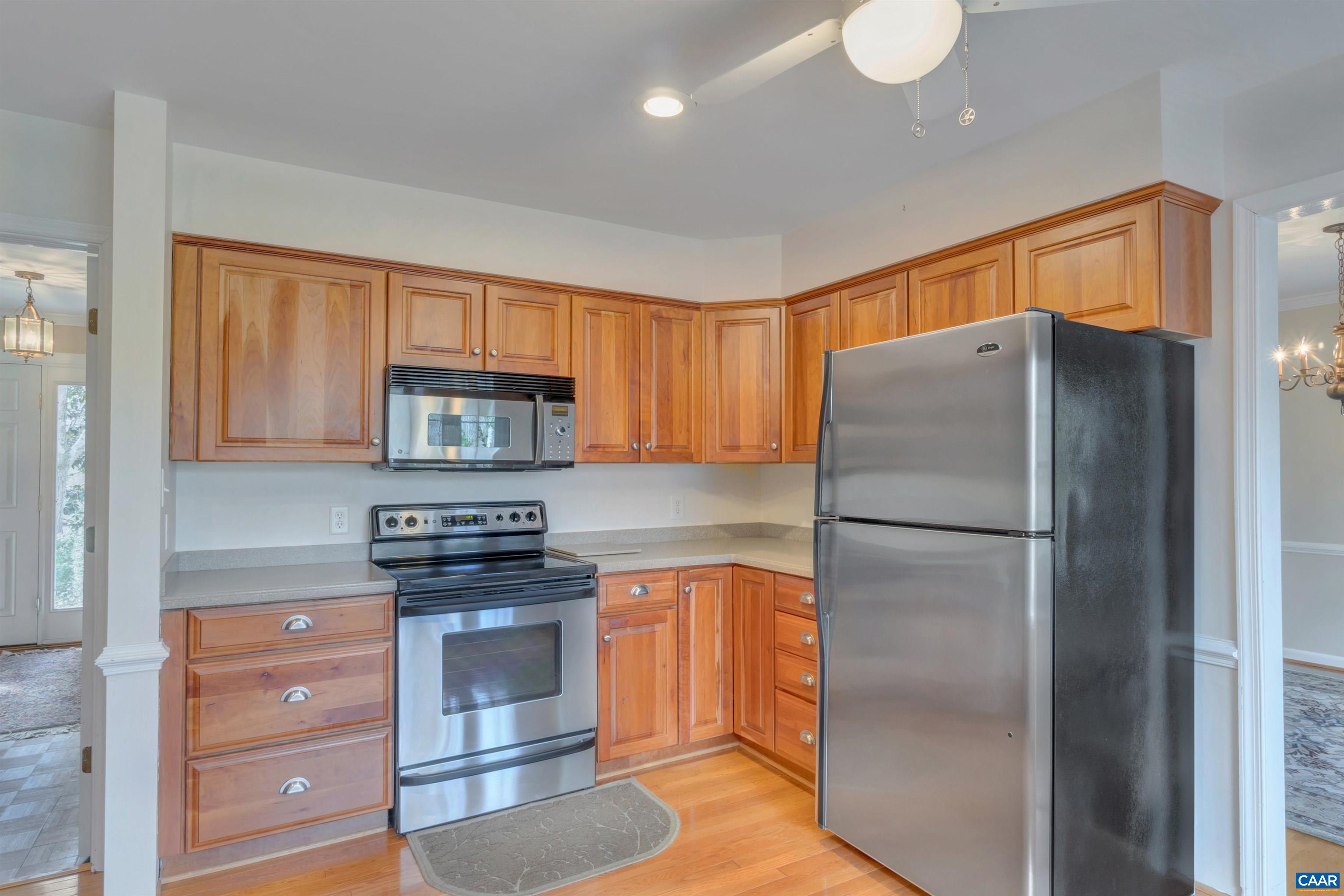 2091 Whippoorwill Road Charlottesville, VA 22901 - Photo 8 of 41 a kitchen with a refrigerator and a stove