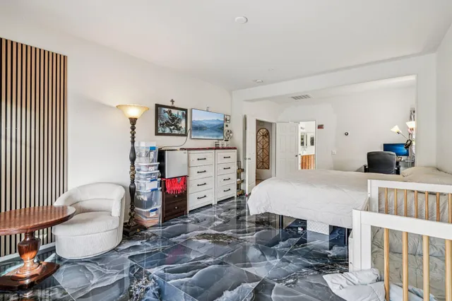 a bathroom with a tub shower and mirror