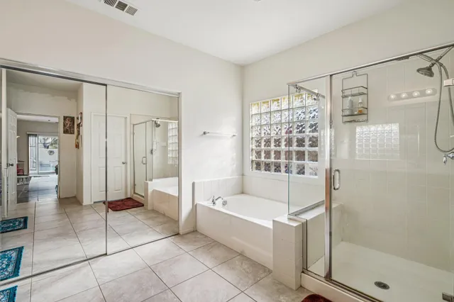 a white toilet sitting next to a bathroom sink