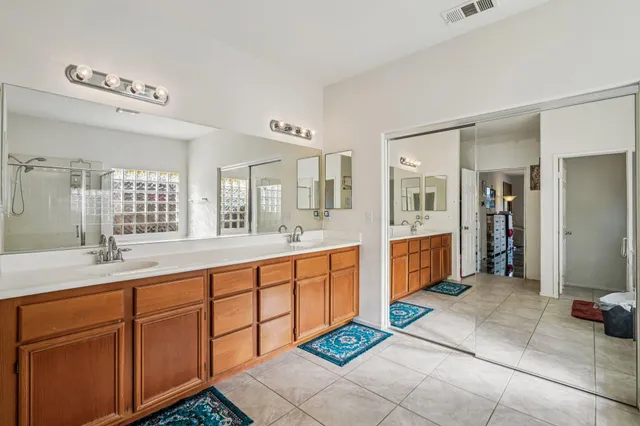 a bedroom with a bed a table and chair