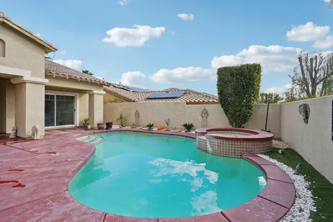 a front view of a house with a yard and seating space