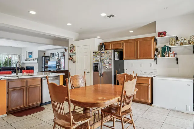 a dining room filled counter top space a dining table and chairs