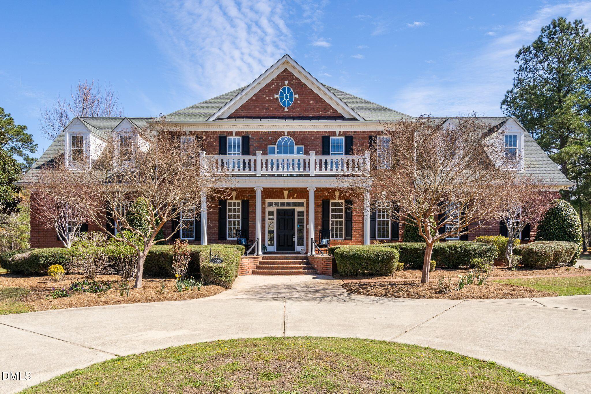 1609 Holland Road Fuquay-Varina, NC 27526 - Photo 1 of 79 a front view of a house with a yard