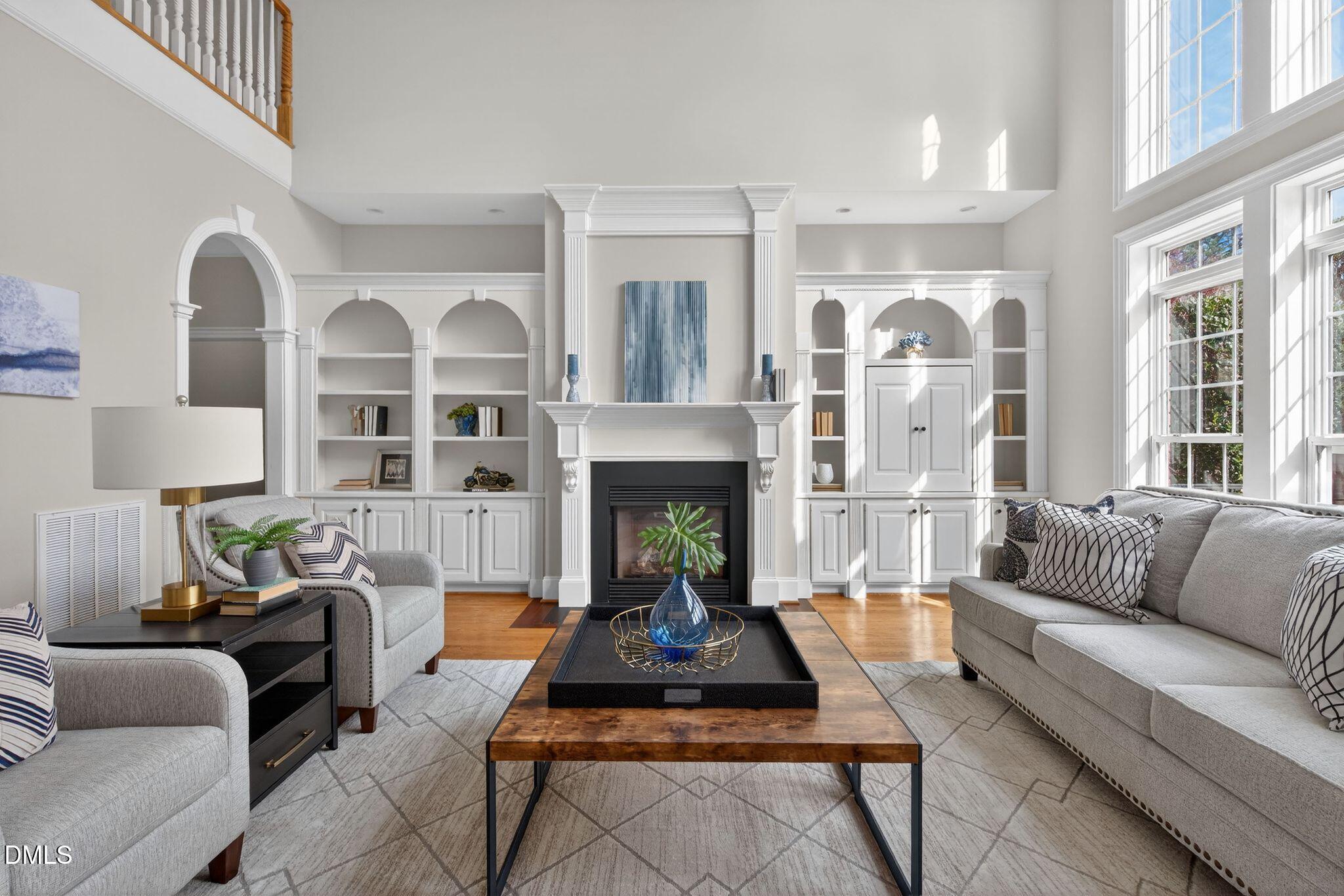 1609 Holland Road Fuquay-Varina, NC 27526 - Photo 11 of 79 a living room with furniture a fireplace and a large window