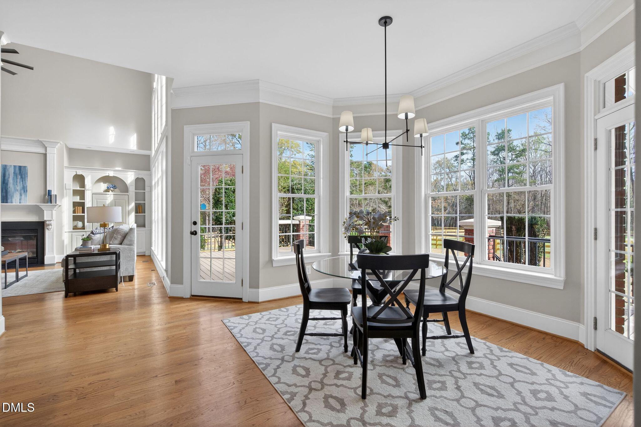 1609 Holland Road Fuquay-Varina, NC 27526 - Photo 20 of 79 a view of a dining room with furniture window and wooden floor