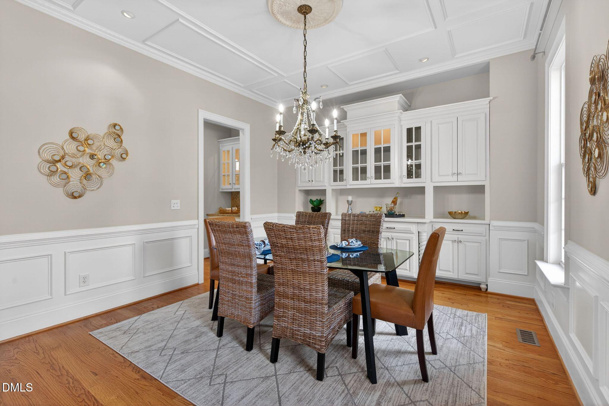 1609 Holland Road Fuquay-Varina, NC 27526 - Photo 24 of 79 a dining room with furniture a rug and wooden floor