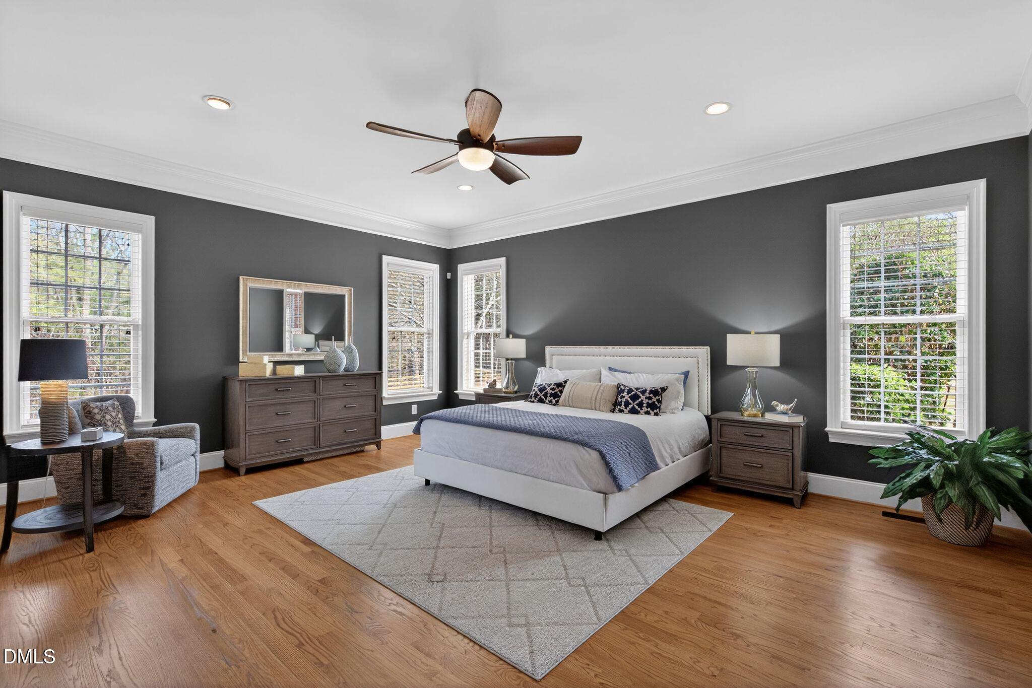 1609 Holland Road Fuquay-Varina, NC 27526 - Photo 26 of 79 a spacious bedroom with a bed and wooden floor