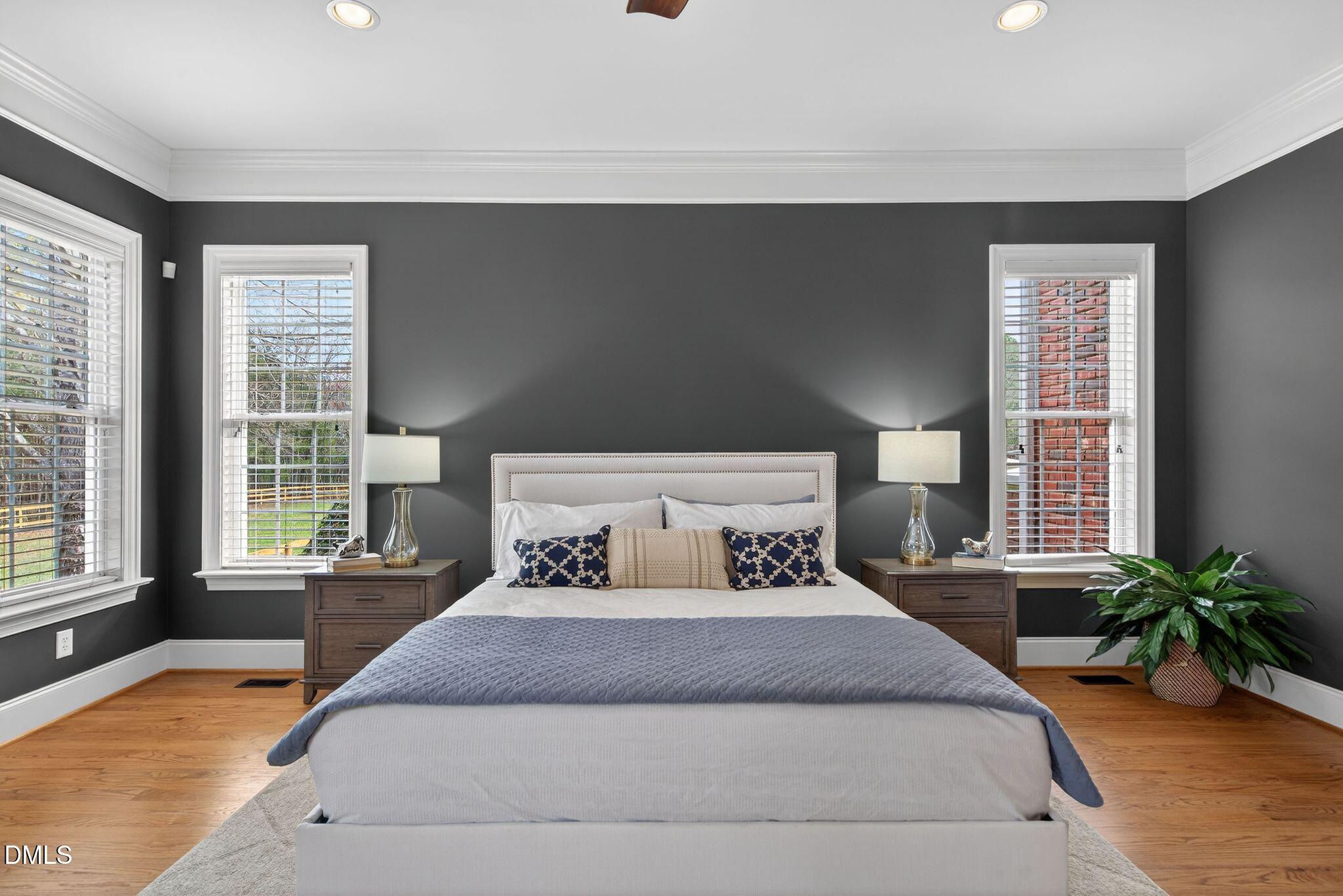 1609 Holland Road Fuquay-Varina, NC 27526 - Photo 27 of 79 a spacious bedroom with a large bed and a large window