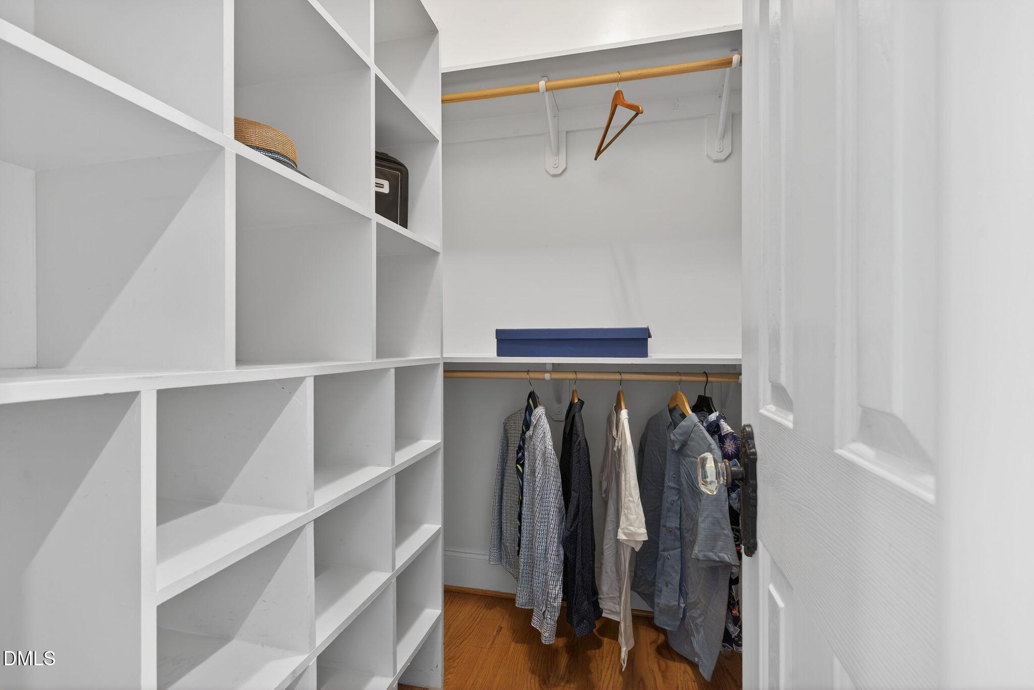 1609 Holland Road Fuquay-Varina, NC 27526 - Photo 28 of 79 a view of walk in closet with clothes and shoes