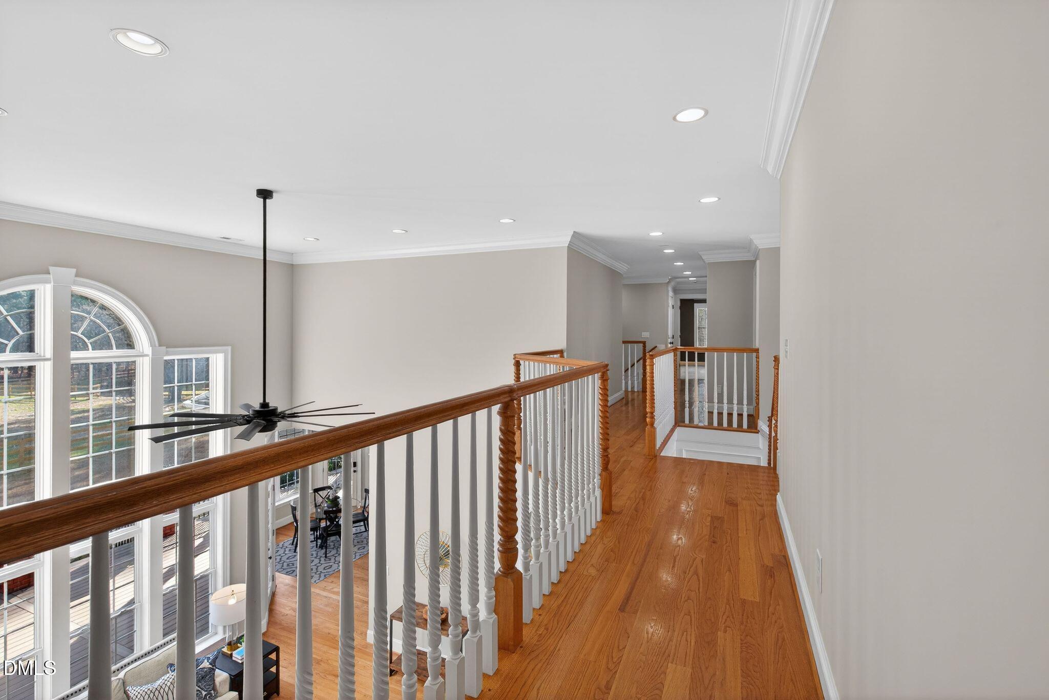 1609 Holland Road Fuquay-Varina, NC 27526 - Photo 37 of 79 a view of a hallway with wooden floor and stairs