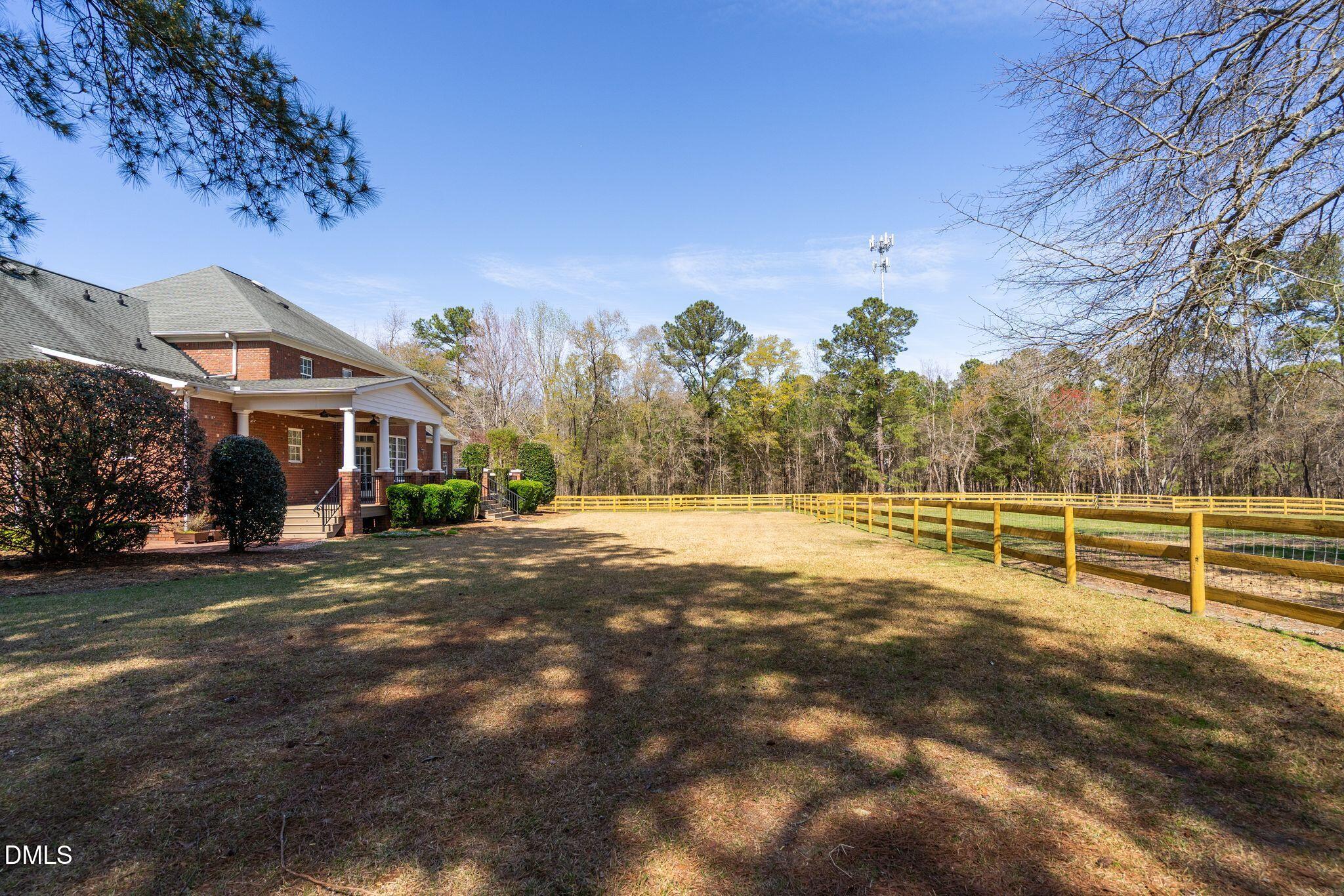 1609 Holland Road Fuquay-Varina, NC 27526 - Photo 49 of 79 a view of a house with a yard