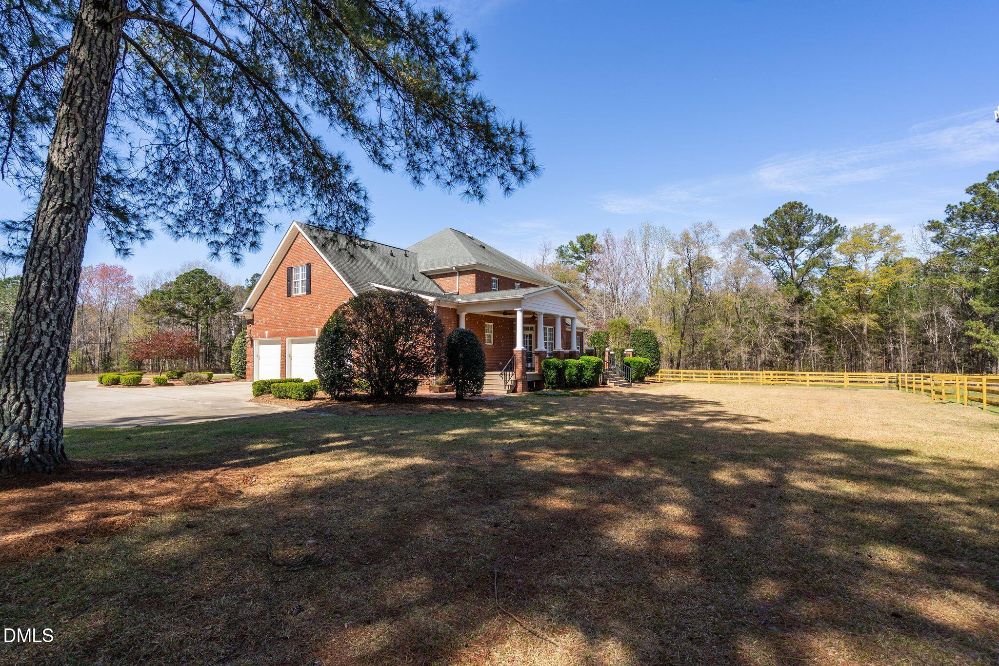 1609 Holland Road Fuquay-Varina, NC 27526 - Photo 50 of 79 a front view of a house with a yard