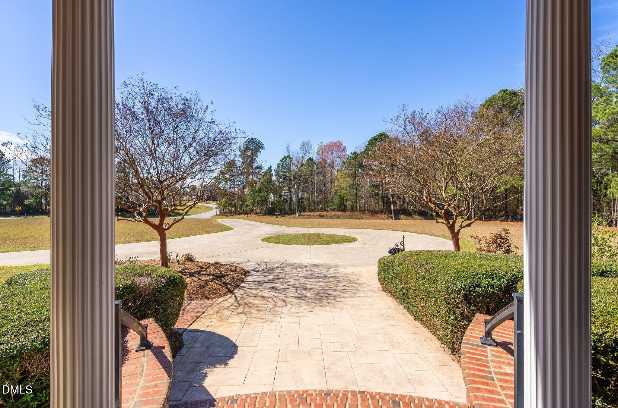 1609 Holland Road Fuquay-Varina, NC 27526 - Photo 5 of 79 a view of a swimming pool with a patio and a yard
