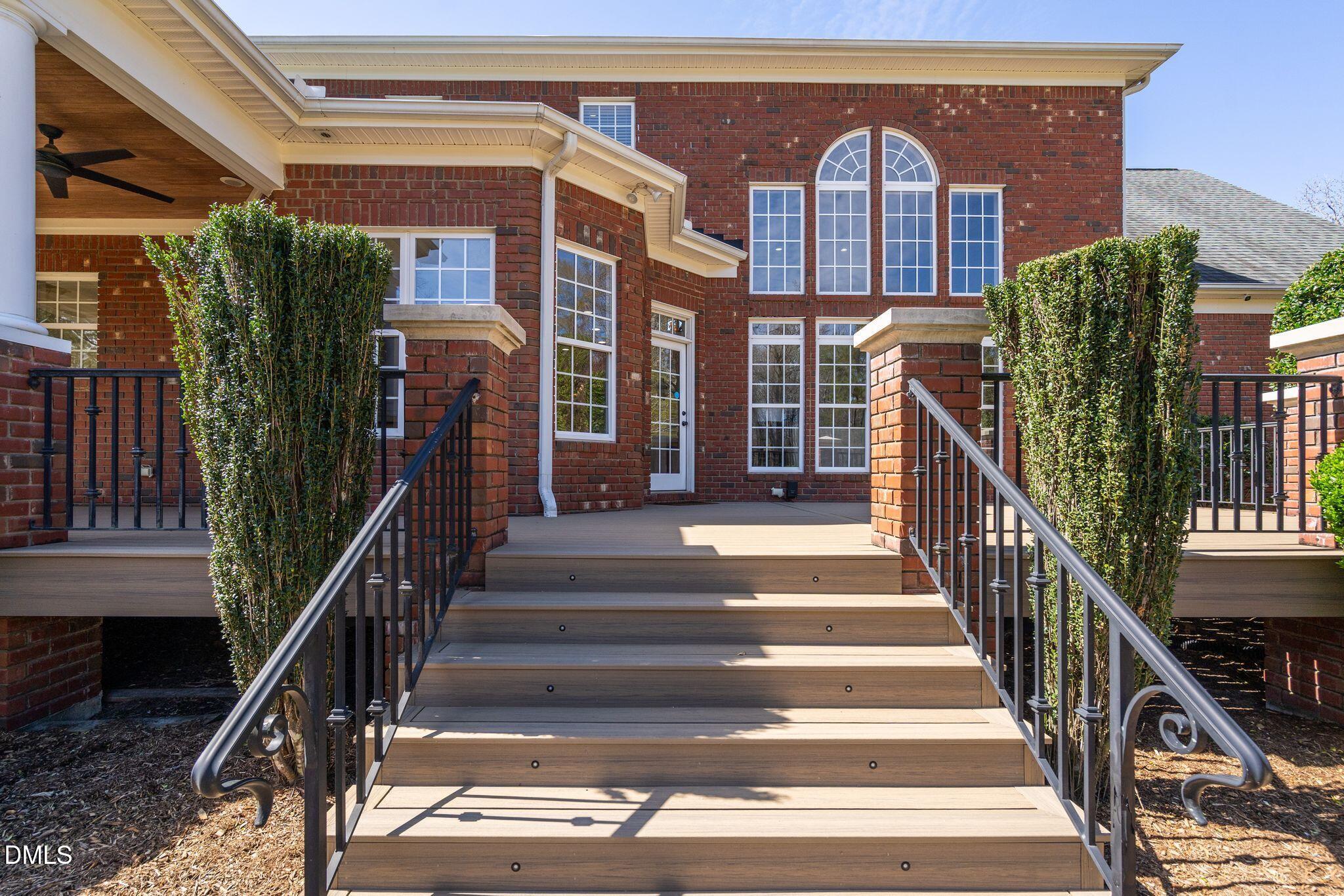 1609 Holland Road Fuquay-Varina, NC 27526 - Photo 53 of 79 a view of staircase with railing and a chandelier
